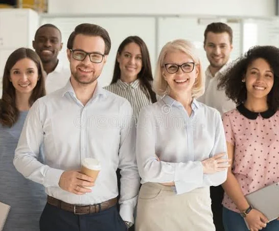 Team standing together in an office